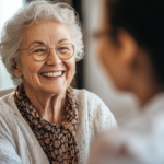 A smiling elderly woman talks with her Medicare doctor at an appointment.